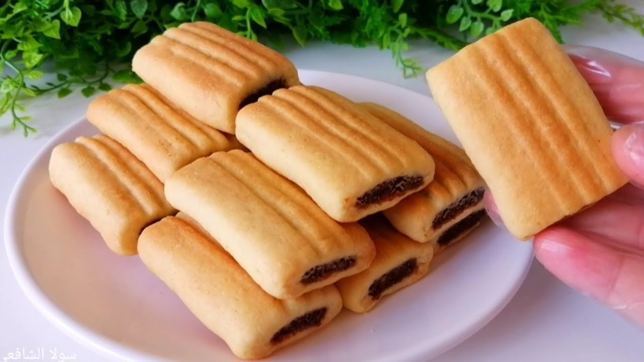 بكوب دقيق.. اعملى كمية كبيرة من بسكويت التمر هش ويذوب بالفم يجنن 5 بكوب دقيق.. اعملى كمية كبيرة من بسكويت التمر هش ويذوب بالفم يجنن